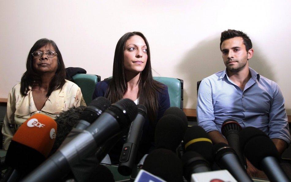 British student Meredith Kerchers family members, from L-R mother Arline, sister Stephanie and brother Lyle attend a news conference in Perugia 