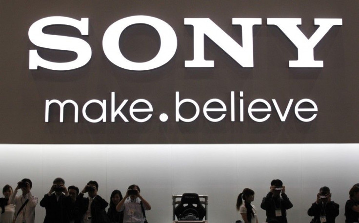 Visitors try Sony Corp's head mounted display personnal 3D Viewer HMZ-T1 (R) and digital binocular DEV-3 at CEATEC JAPAN 2011 electronics show in Chiba, east of Tokyo