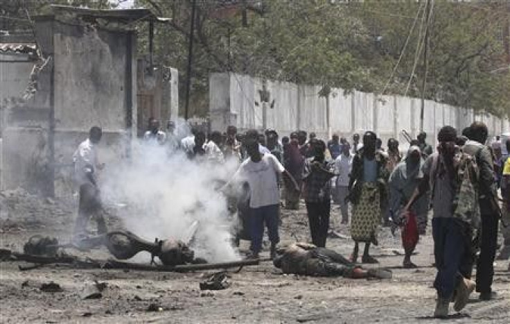 Residents gather at the scene of a suicide attack in Somalia&quot;s