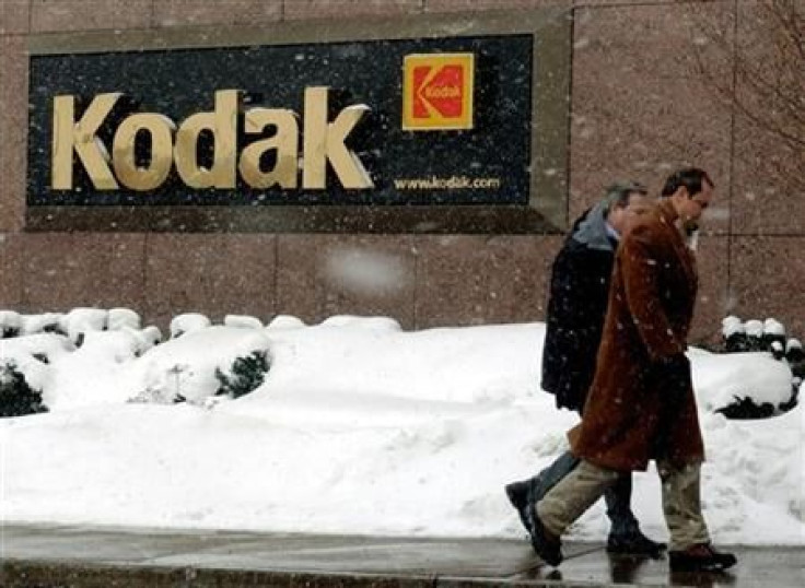 WORKER ENTERS KODAK CORPORATE HEADQUARTERS IN ROCHESTER NEW YORK.