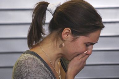 Amanda Knox is overcome with emotion after speaking at a news conference at Sea-Tac International Airport, Washington