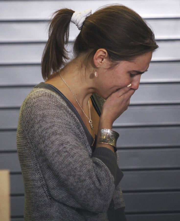 Amanda Knox is overcome with emotion after speaking at a news conference at Sea-Tac International Airport, Washington