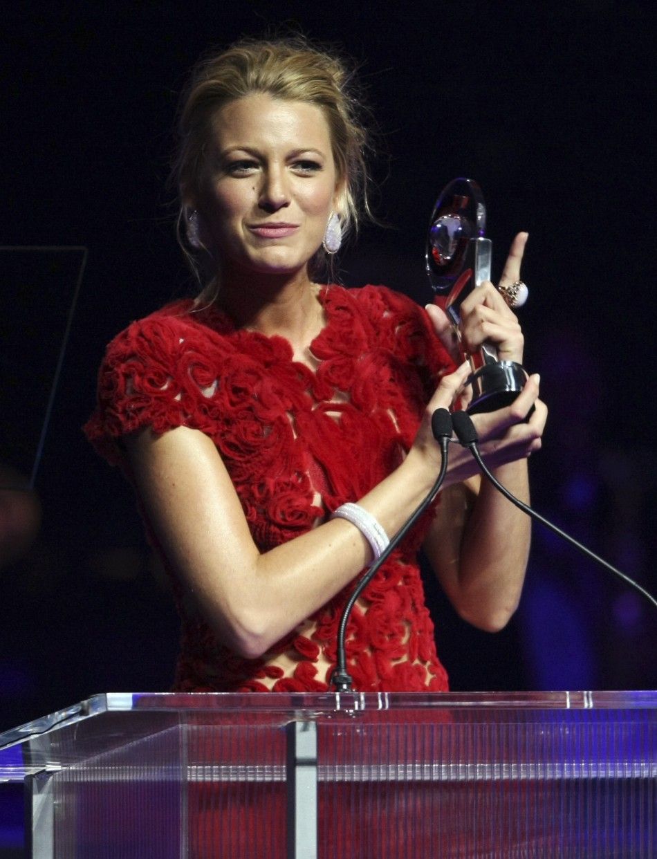 Actress Blake Lively holds up her award for Breakthrough Performer of the Year during CinemaCon in Las Vegas