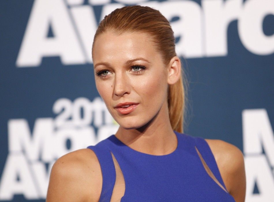 Actress Blake Lively poses for photographers in the photo room at the 2011 MTV Movie Awards in Los Angele