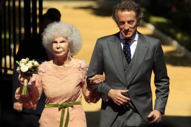 Spain's Duchess of Alba Cayetana Fitz-James Stuart y Silva and her husband Alfonso Diez pose at the enrance of Las Duenas Palace after their wedding in Seville