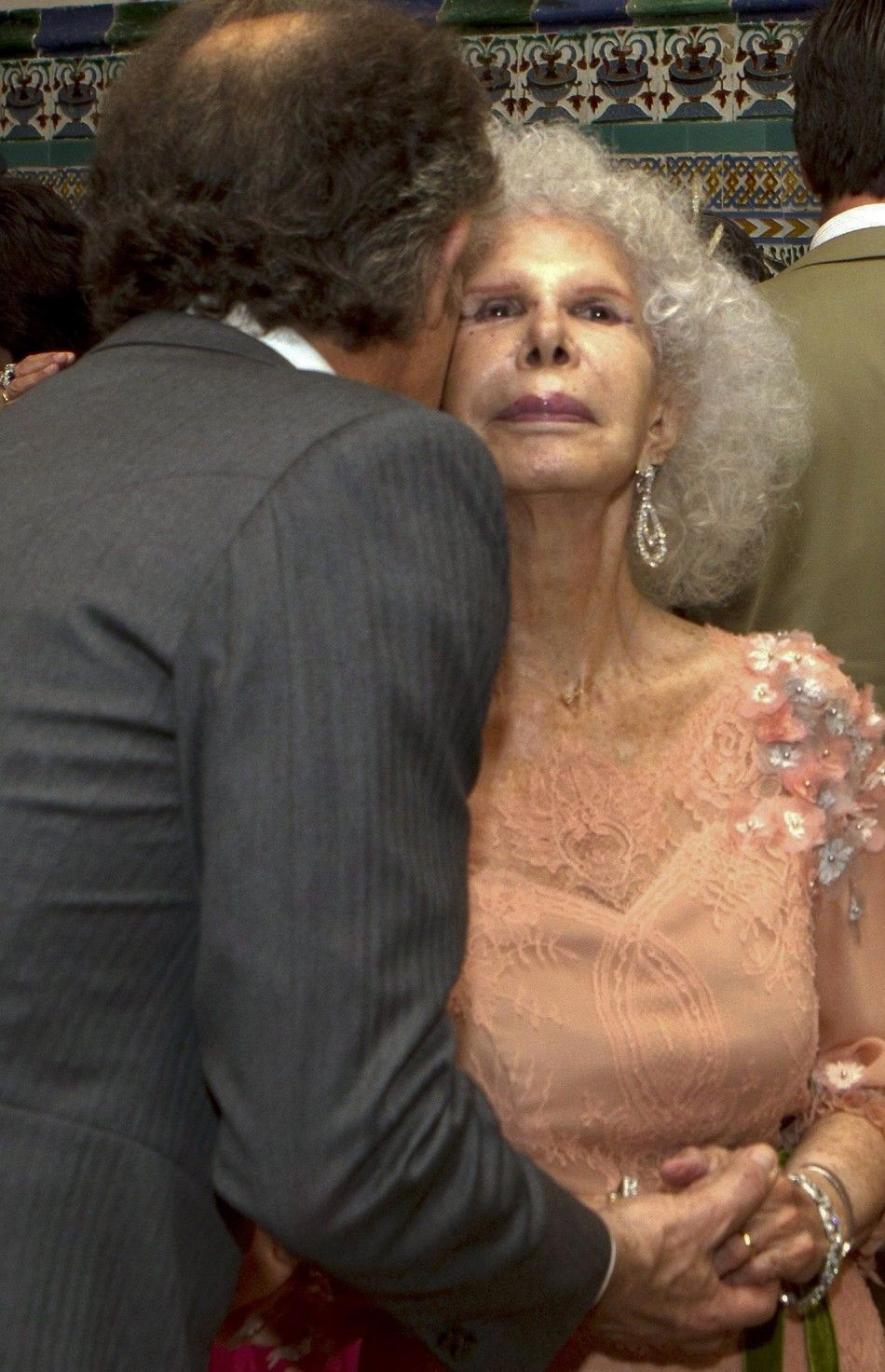 Spains Duchess of Alba Cayetana Fitz-James Stuart y Silva is kissed by her husband Alfonso Diez after their wedding ceremony in Seville