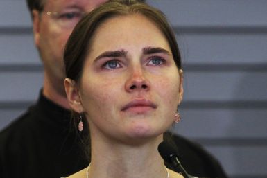 Amanda Knox pauses while speaking during a news conference at Sea-Tac International Airport
