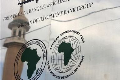 A minaret is reflected in the signage for the newly inaugurated African Development Bank