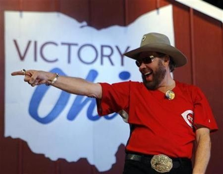 Singer Hank Williams Jr. points into the crowd at a campaign rally with Senator John McCain in Columbus, Ohio