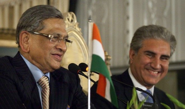 Pakistan's Foreign Minister Shah Mehmood Qureshi (R) and his Indian counterpart S.M. Krishna smile after a question from a journalist during their joint news conference in Islamabad July 15, 2010 