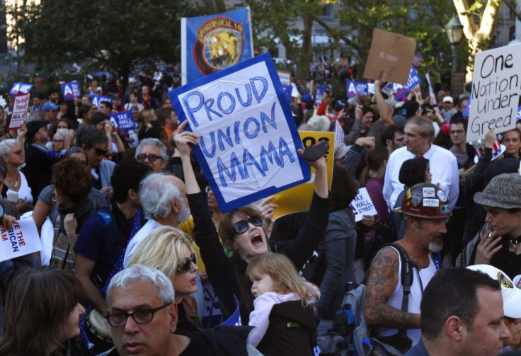 A woman and her child take part in an Occupy Wall Street demonstration in Foley Square in New York City