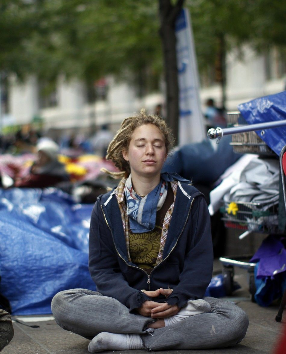 An Occupy Wall Street protester meditates at Zuccotti Park in lower Manhattan in New York 