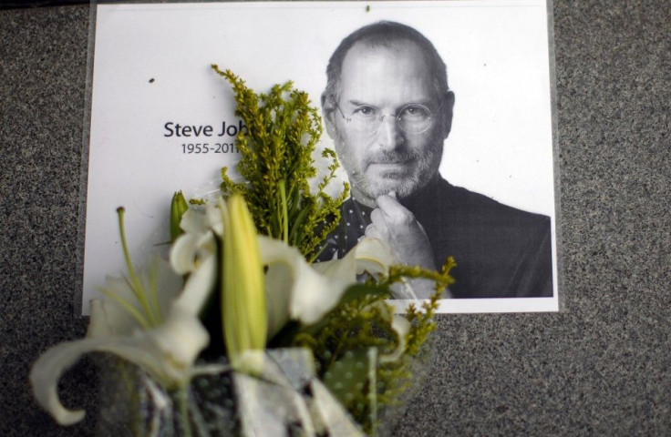 Flowers for Apple co-founder Steve Jobs are seen outside an Apple Store in downtown Shanghai