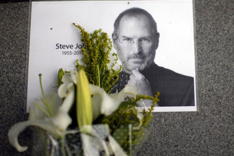 Flowers for Apple co-founder Steve Jobs are seen outside an Apple Store in downtown Shanghai