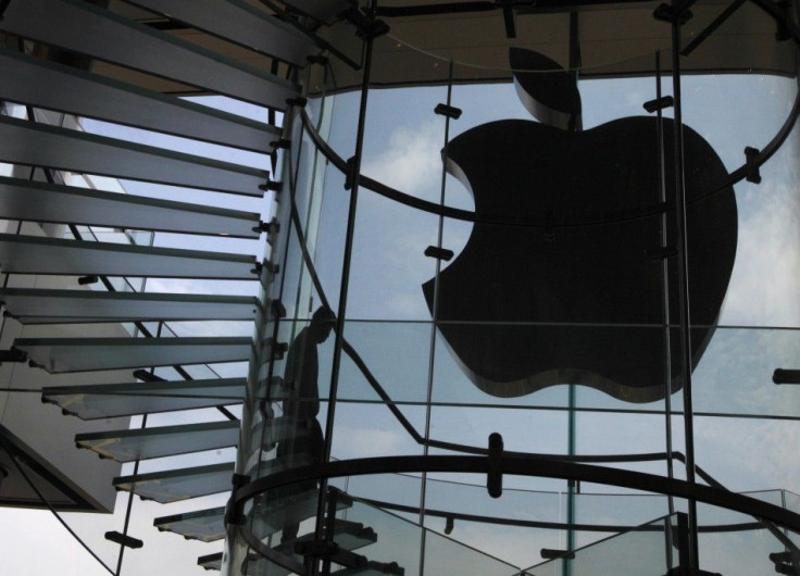 An Apple logo is seen after its light was switched off to mourn the death of ex-CEO Steve Jobs in an Apple store in Hong Kong