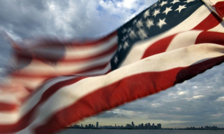 A U.S. flag flutters over top of the skyline of New York and Jersey City as seen from Bayonne, New Jersey