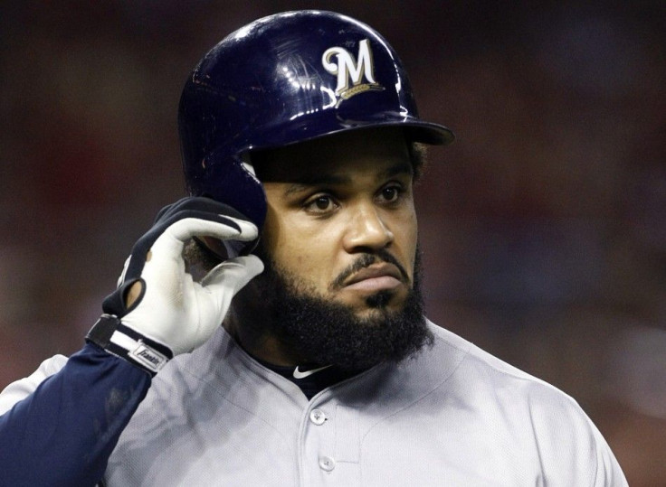 Brewers Prince Fielder walks back to the dugout after striking out against the Arizona in Phoenix