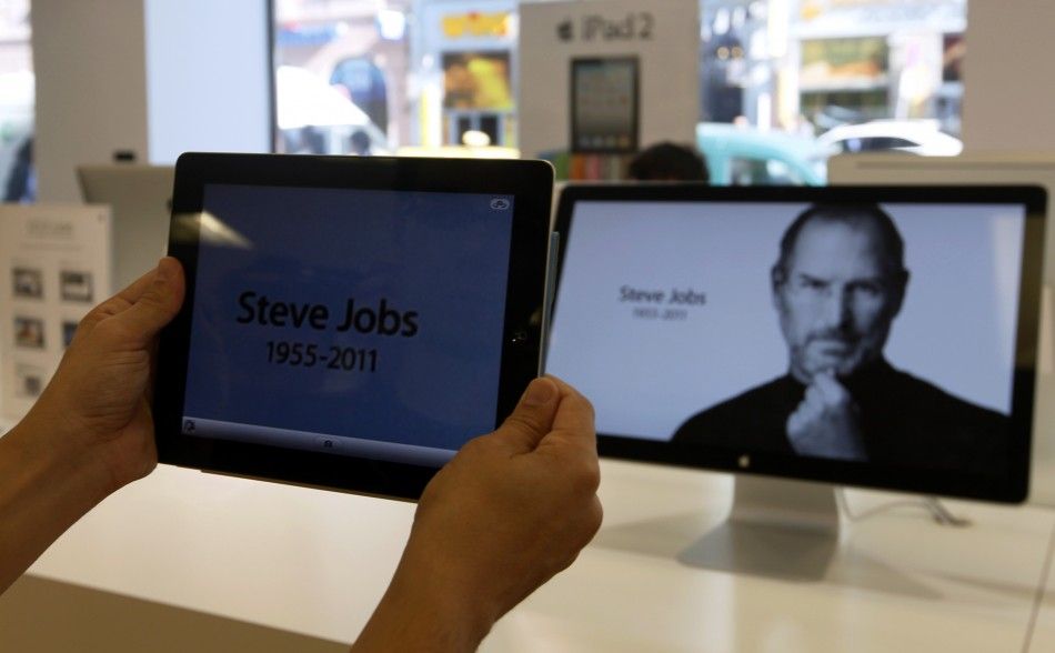 A customer holds an iPad in an Apple store in central Prague