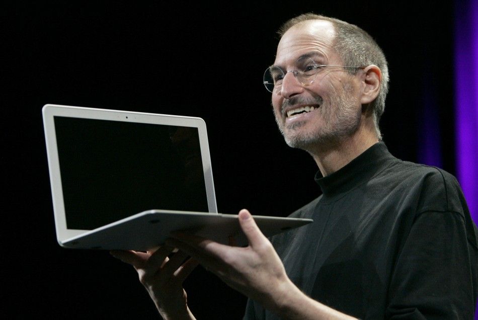 Apple CEO Steve Jobs shows the new MacBook Air during the Macworld Convention and Expo in San Francisco, California