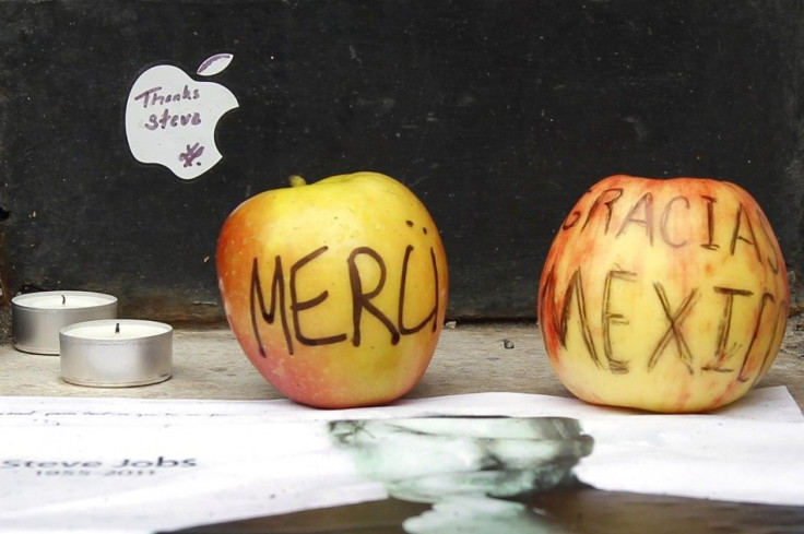 Two apples are placed at the entrance the Apple store in Paris