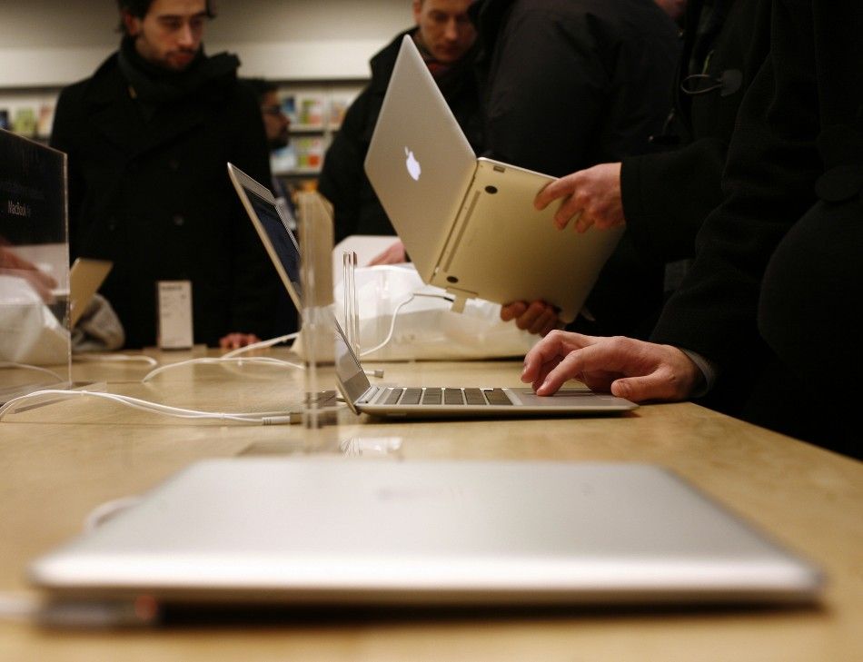 Customers try out the MacBook Air at the Apple Store in New York
