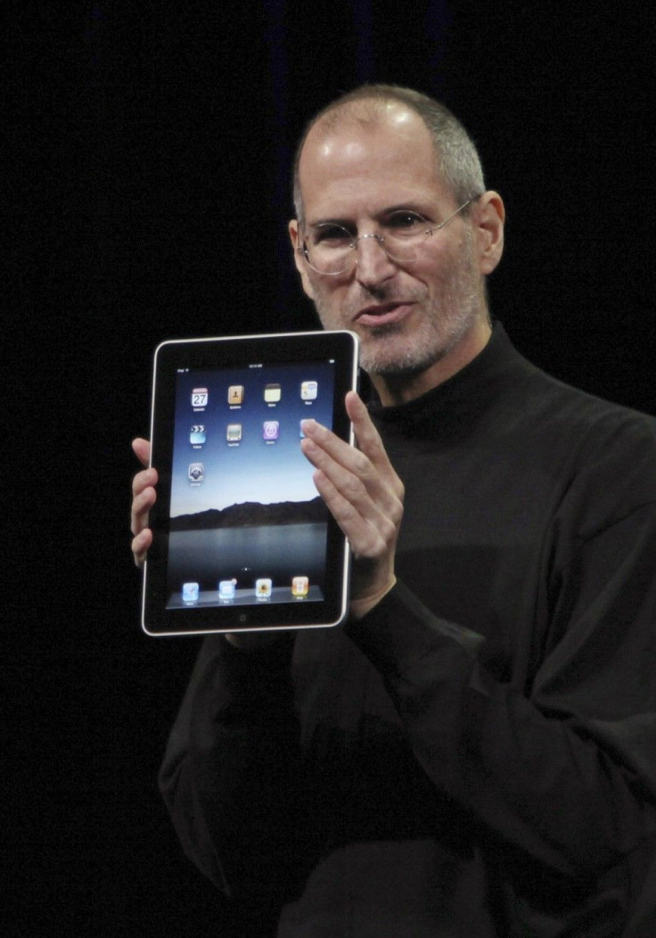 Apple CEO Steve Jobs with new tablet computer during launch in San Francisco