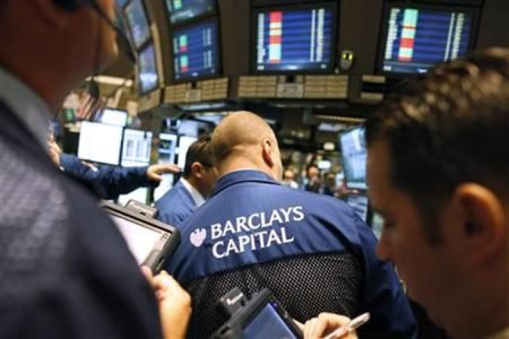 Traders gather at the Barclays Capital's kiosk on the floor of the New York Stock