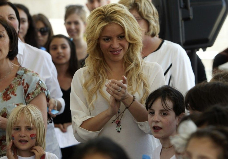 Colombian pop star and the UNICEF ambassador, Shakira, applauds as children from the Max Payne Hand in Hand School for Bilingual Education sing to her in Jerusalem