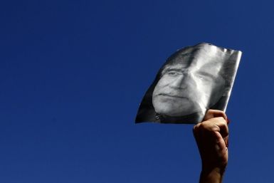 A demonstrator holds up a portrait of the late Turkish- Armenian writer Hrant Dink in Istanbul