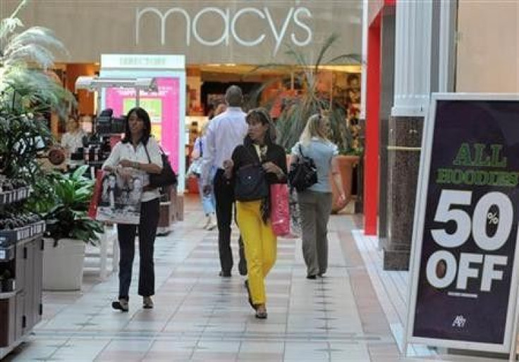 Shoppers carrying bags walk at the Pentagon City Shopping Mall in Arlington, Virginia