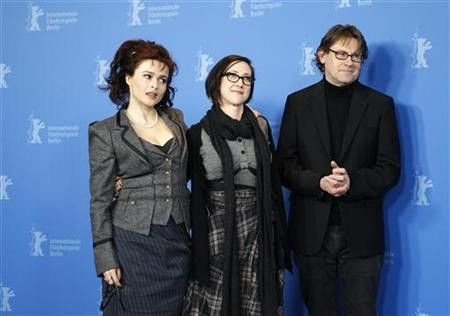 Actress Helena Bonham Carter, director SJ Clarkson and author Nigel Slater (L-R) pose during a photocall to promote the movie 'Toast' at the 61st Berlinale International Film Festival in Berlin