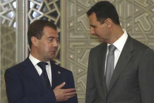 Russia&#039;s President Dmitry Medvedev chats with Syria&#039;s President Bashar al-Assad before a news conference in Damascus