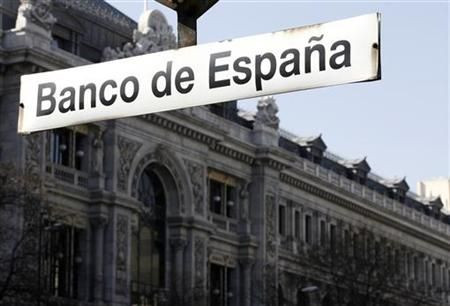 The Bank of Spain is seen behind a sign in Madrid
