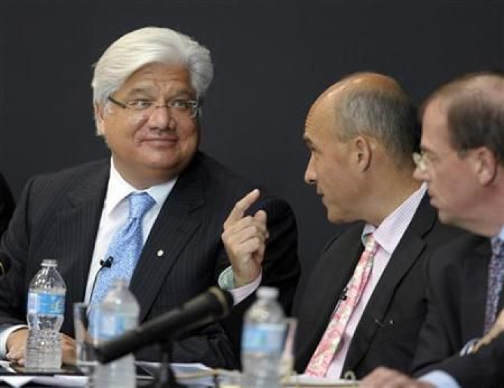 Research In Motion Co-CEOs Balsillie and Lazaridis talk during the annual general meeting of shareholders in Waterloo