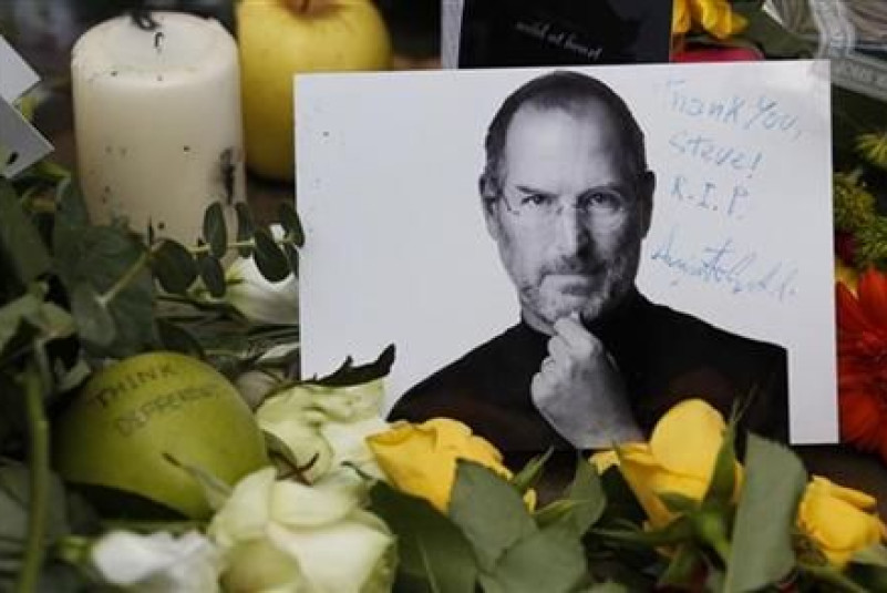 Tributes to the late Steve Jobs are left outside the Apple Store in London