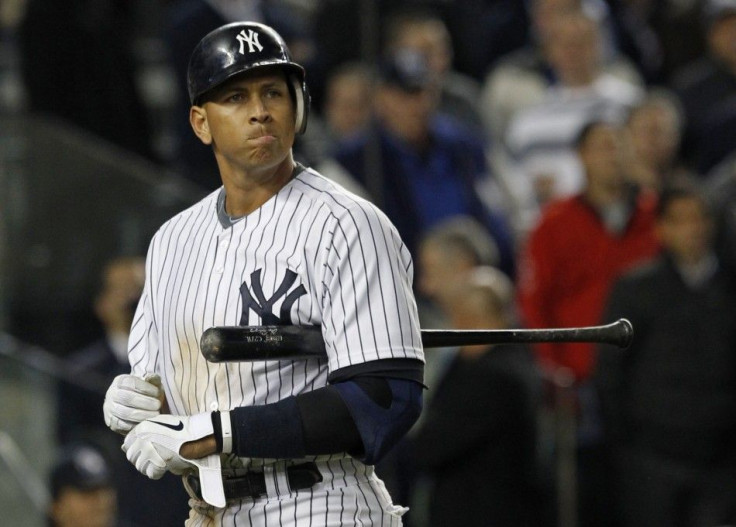 New York Yankees' Alex Rodriguez reacts after striking out with the bases loaded against the Detroit Tigers during the seventh inning of Game 5 of their MLB American League Division Series baseball playoffs at Yankee Stadium in New York