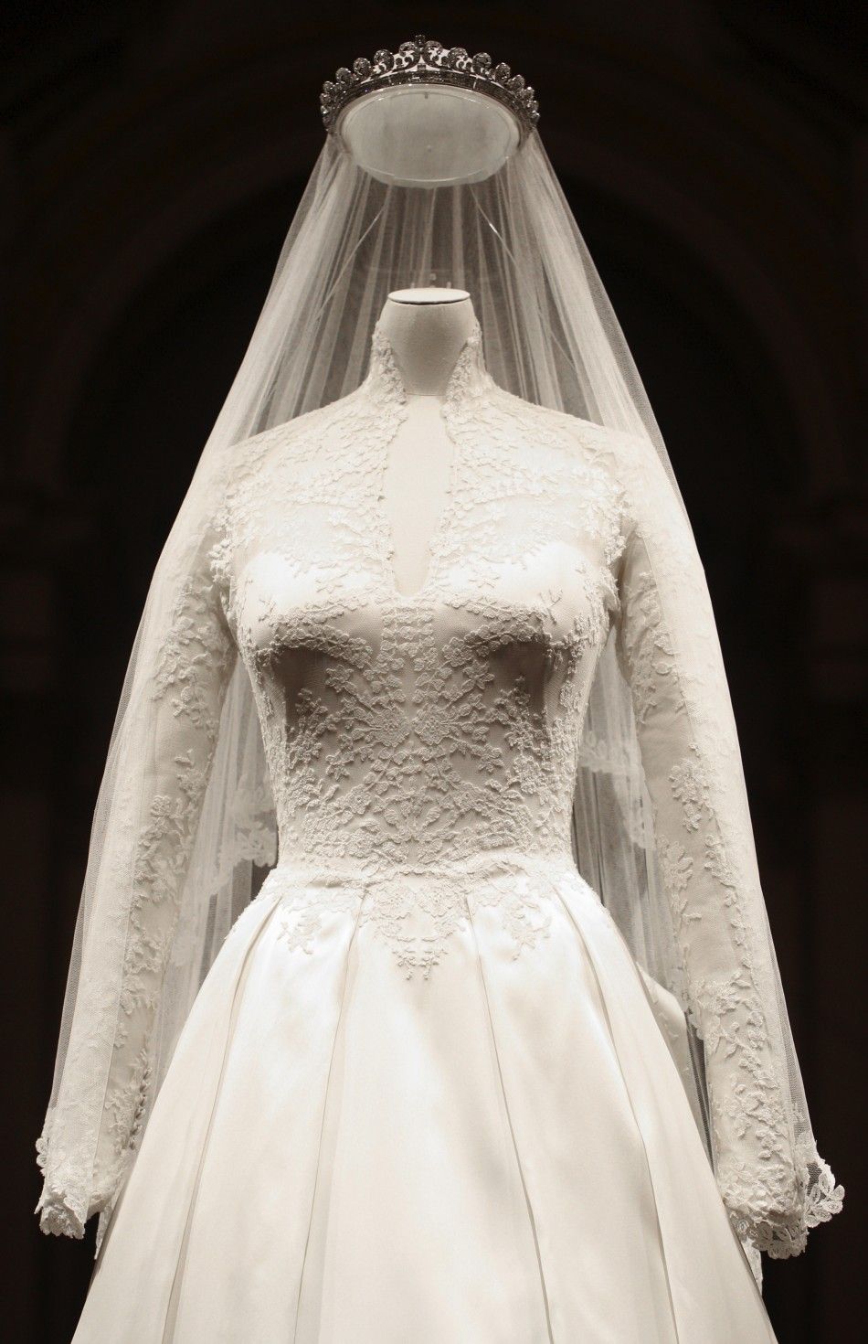 The wedding dress of Britains Catherine, Duchess of Cambridge is seen as it is prepared for display at Buckingham Palace in London