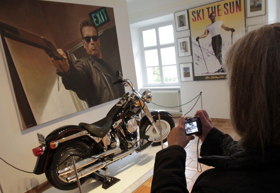 A visitor takes photographs inside the house where Austrian actor, former champion bodybuilder and former California governor Arnold Schwarzenegger was born, in the southern Austrian village of Thal