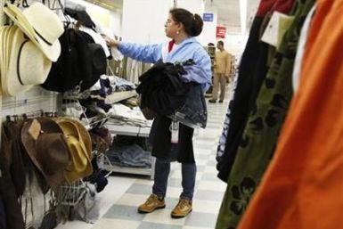 A woman shops for clothes at a department