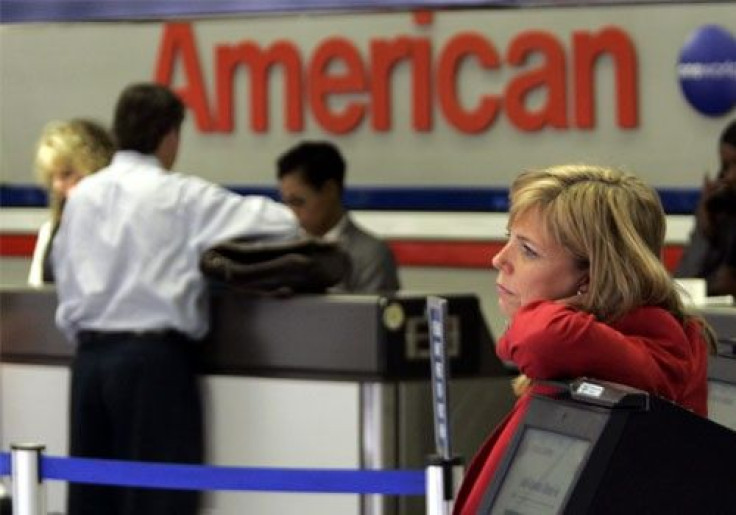 An American Airlines passenger service representative stands at Dallas/Fort Worth International Airport in Gapevine, Texas