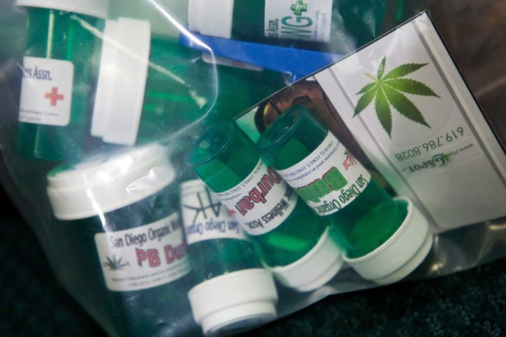 Retail marijuana packaging is displayed at a U.S. Attorney's news conference in Sacramento.