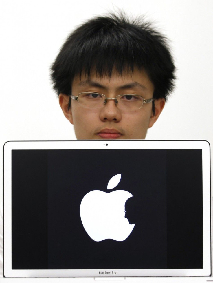 Hong Kong design student Jonathan Mak poses with a symbol in Hong Kong