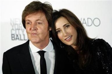 Former Beatle Paul McCartney and his fiancee, New York heiress Nancy Shevell, arrive for the world premiere of his ballet “Ocean’s Kingdom” in New York