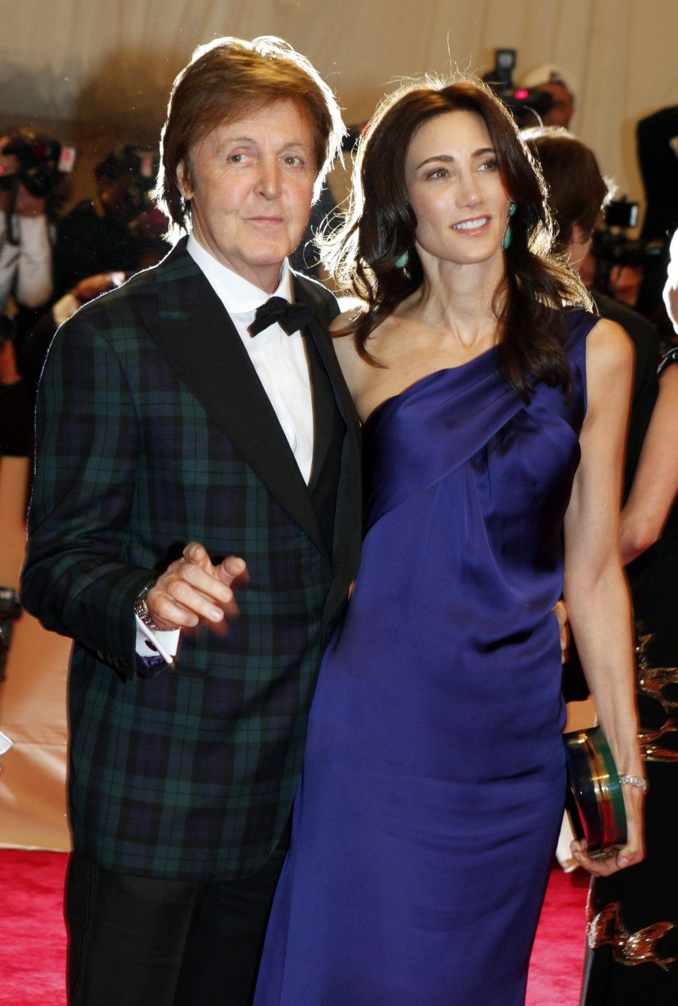 Nancy Shevell and Paul McCartney pose on arrival at the Metropolitan Museum of Art Costume Institute Benefit celebrating the opening of Alexander McQueen Savage Beauty in New York
