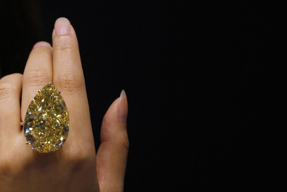 A model displays the Sun-Drop diamond during a media preview in Hong Kong