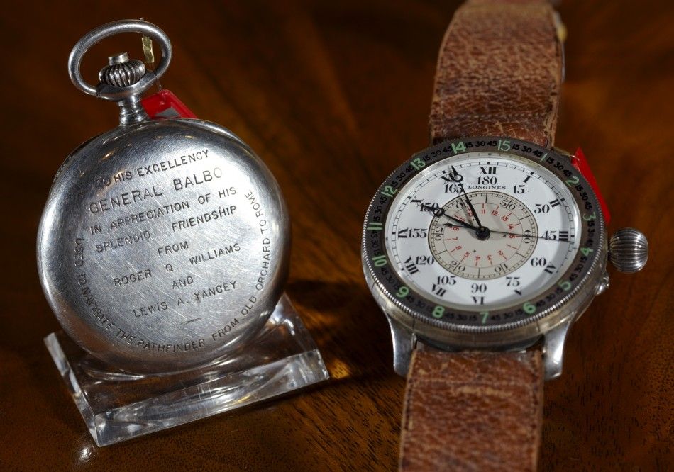 A silver Longines chronograph watch and an oversized silver hour angle aviators wristwatch during an auction at Christies in Geneva