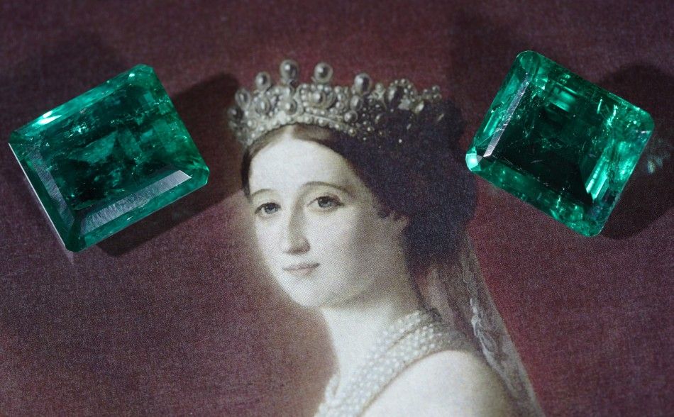 Two unmounted emeralds weighing 17.97 and 15.99 carats are pictured during an auction preview at Christies in Geneva