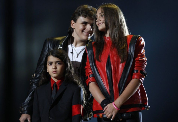 Michael Jackson&#039;s children (L-R) Blanket, Prince and Paris stand on stage during the &quot;Michael Forever&quot; tribute concert, which honours late pop icon Michael Jackson, at the Millennium Stadium in Cardiff, Wales