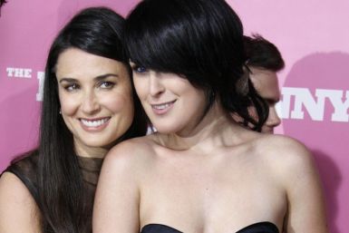 Rumer Willis (R), cast member of the comedy film &quot;The House Bunny&quot;, poses with her mother actress Demi Moore at the film's premiere in Los Angeles 