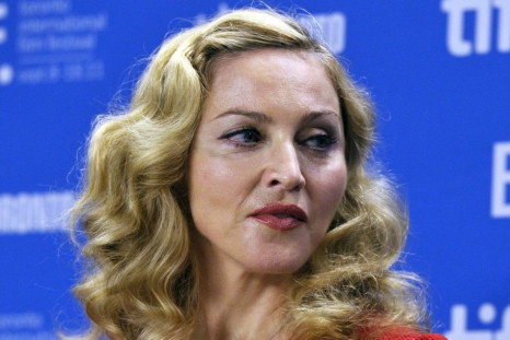Judging from what her manager tweeted Wednesday, Madonna's not amused that a source published a track called &quot;Give Me All Your Love&quot; while she was in the middle of recording it.